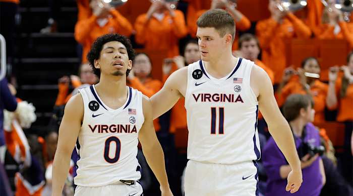 Dec 6, 2022; Charlottesville, Virginia, USA; Virginia Cavaliers guard Kihei Clark (0) reacts with Cavaliers guard Isaac McKneely (11) after their game against the James Madison Dukes at John Paul Jones Arena.